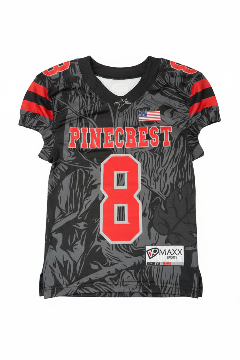 Black sports jersey with red and white text and numbers, featuring a brand label on a gray background.