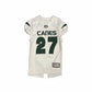White sports jersey with green text and numbers on a dark background
